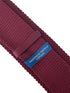 maroon knitted tie with white embroidered fleur de lis lys design